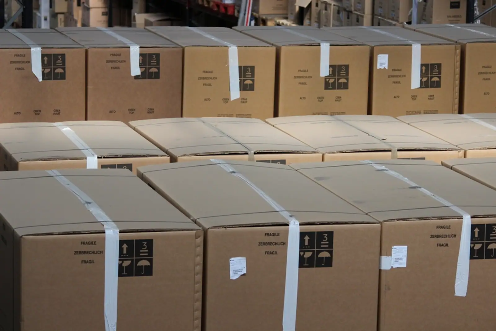 Rows of sealed brown master cartons stacked in a warehouse