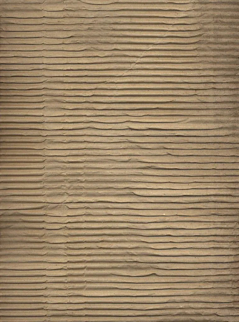 Close-up of brown corrugated board with vertical flutes